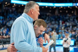 Creighton Bluejays Greg McDermott and Steven Ashworth embrace against St John's Red Storm after a college basketball game Tuesday, December 31, 2024, in Omaha, Nebraska. Photo by Brandon Tiedemann.