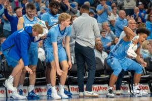 Creighton Bluejays bench celebrates after a big play against St John's Red Storm during a college basketball game Tuesday, December 31, 2024, in Omaha, Nebraska. Photo by Brandon Tiedemann.