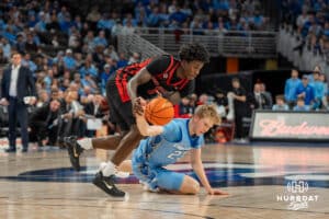 Creighton Bluejays Jackson McAndrews chases after a loose ball against St John's Red Storm during a college basketball game Tuesday, December 31, 2024, in Omaha, Nebraska. Photo by Brandon Tiedemann.