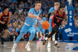 Creighton Bluejays Steven Ashworth pushes the ball against St John's Red Storm during a college basketball game Tuesday, December 31, 2024, in Omaha, Nebraska. Photo by Brandon Tiedemann.