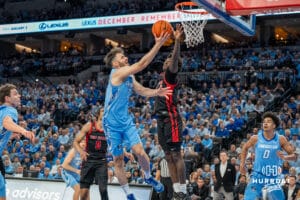 Creighton Bluejays Fedor Žugić attempts a layup against St John's Red Storm during a college basketball game Tuesday, December 31, 2024, in Omaha, Nebraska. Photo by Brandon Tiedemann.