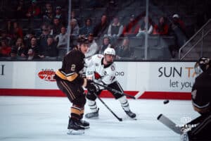 UNO Mavericks player, Myles Hilman, takes a shot at the goal during a college hockey game on Dec 29, 2024 in Omaha, Nebraska. Photo by Logan Hock