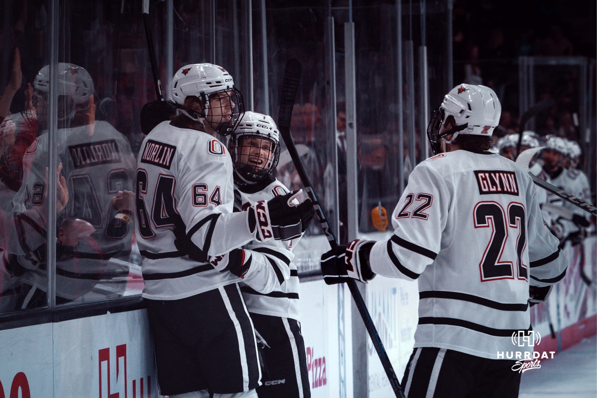 UNO Hockey v Manitoba 2024-12-29 UNO Mavericks players, Jimmy Glynn, Griffin Ludtke, and Isaiah Norlin celebrate a goal during a college hockey game on Dec 29, 2024 in Omaha, Nebraska. Photo by Logan Hock