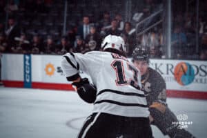 UNO Mavericks player, Jacob Slipec, faces off against a Manitoba player during a college hockey game on Dec 29, 2024 in Omaha, Nebraska. Photo by Logan Hock