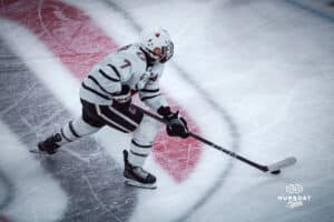 UNO Mavericks player, Griffin Ludtke, handles a puck during a college hockey game on Dec 29, 2024 in Omaha, Nebraska. Photo by Logan Hock