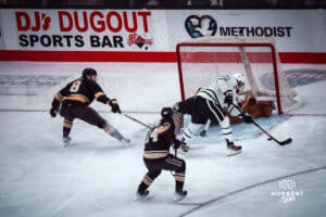 UNO Mavericks, Tyler Rollwagen, attempts a goal during a college hockey game on Dec 29, 2024 in Omaha, Nebraska. Photo by Logan Hock