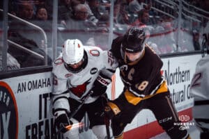 UNO Mavericks player, Brock Bremer, clashes with a Manitoba player during a college hockey game on Dec 29, 2024 in Omaha, Nebraska. Photo by Logan Hock
