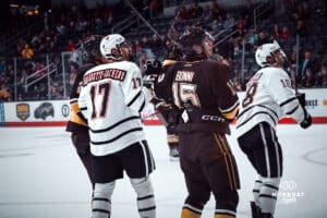UNO Mavericks player Alexi Van Houtte-Cachero watches a potential goal during a college hockey game on Dec 29, 2024 in Omaha, Nebraska. Photo by Logan Hock