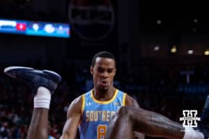 Southern University Jaguars center Dionjahe Thomas (8) reacts to his teammate landing on the court after going over the top of Nebraska Cornhuskers forward Andrew Morgan (23) in the first half during college basketball game, Monday, December 30, 2024, in Lincoln, Nebraska. Photo by John S. Peterson.