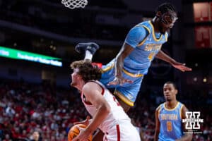 Southern University Jaguars forward Derrick Tezeno (4) goes over the top of Nebraska Cornhuskers forward Andrew Morgan (23) in the first half during college basketball game, Monday, December 30, 2024, in Lincoln, Nebraska. Photo by John S. Peterson.