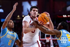 Nebraska Cornhuskers forward Berke Buyuktuncel (9) drives towards the basket against Southern University Jaguars guard Andre Nunley (9) and Michael Jacobs in the first half during college basketball game, Monday, December 30, 2024, in Lincoln, Nebraska. Photo by John S. Peterson.
