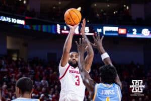 Nebraska Cornhuskers Brice Williams makes a three point shot against Southern's DaMariee Jones (1) in the first half during college basketball game, Monday, December 30, 2024, in Lincoln, Nebraska. Photo by John S. Peterson.