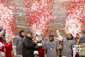 Nebraska Cornhuskers head coach Matt Rhule holding the trophy with confetti cannon going off after the win over the Boston College Eagles during the Pinstripe Bowl game, Saturday, December 28, 2024, in New York, New York. Photo by John S. Peterson.