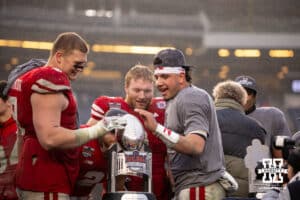 Nebraska Cornhuskers Ty Robinson, Isaac Gifford (2) Nach Hutmacker, and Dylan Raiola check out the trophy after the in over the Boston College Eagles during the Pinstripe Bowl game, Saturday, December 28, 2024, in New York, New York. Photo by John S. Peterson.