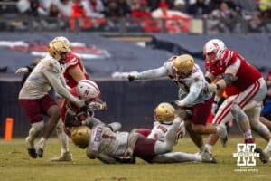 Nebraska Cornhuskers running back Emmett Johnson (21) tackled by Boston College Eagles linebacker Daveon Crouch (1) during the Pinstripe Bowl game, Saturday, December 28, 2024, in New York, New York. Photo by John S. Peterson.