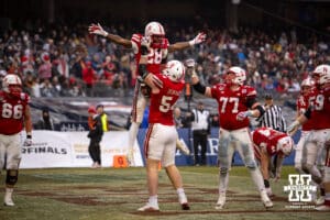 Nebraska Cornhuskers offensive lineman Bryce Benhart (54) throws up running back Kwinten Ives (28) celebrating a touchdown against the Boston College Eagles during the Pinstripe Bowl game, Saturday, December 28, 2024, in New York, New York. Photo by John S. Peterson.