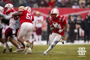 Nebraska Cornhuskers running back Rahmir Johnson (14) runs with the ball against the Boston College Eagles during the Pinstripe Bowl game, Saturday, December 28, 2024, in New York, New York. Photo by John S. Peterson.