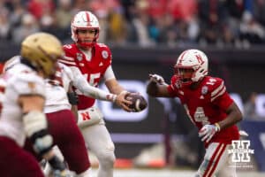 Nebraska Cornhuskers quarterback Dylan Raiola (15) hands the ball off to Rahmir Johnson against the Boston College Eagles during the Pinstripe Bowl game, Saturday, December 28, 2024, in New York, New York. Photo by John S. Peterson.