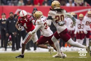 Nebraska Cornhuskers wide receiver Jahmal Banks (4) stiff-arms Boston College Eagles defensive back Ashton McShane (35) during the Pinstripe Bowl game, Saturday, December 28, 2024, in New York, New York. Photo by John S. Peterson.
