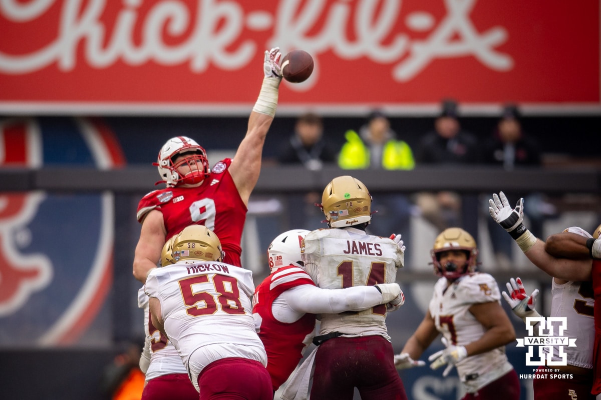 Nebraska Cornhuskers defensive lineman Ty Robinson (9) blocks a pass by Boston College Eagles quarterback Grayson James (14) during the Pinstripe Bowl game, Saturday, December 28, 2024, in New York, New York. Photo by John S. Peterson.