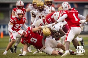 Nebraska Cornhuskers defensive lineman Ty Robinson (9) and linebacker Javin Wright (33) tackles Boston College Eagles Jordan McDonald (24) during the Pinstripe Bowl game, Saturday, December 28, 2024, in New York, New York. Photo by John S. Peterson.