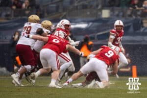 Nebraska Cornhuskers defensive lineman Ty Robinson (9) makes a tackle in messy conditions against the Boston College Eagles during the Pinstripe Bowl game, Saturday, December 28, 2024, in New York, New York. Photo by John S. Peterson.