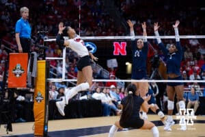 Nebraska Cornhuskers outside hitter Harper Murray (27)spikes the ball against the Penn State Nittany Lions during the semi-final round in the NCAA championship Thursday, December 19, 2024, in Louisville, Kentucky. Photo by John S. Peterson.