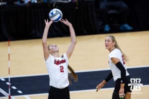 Nebraska Cornhuskers setter Bergen Reilly (2) sets the ball for Nebraska Cornhuskers middle blocker Andi Jackson (15) against the Penn State Nittany Lions during the semi-final round in the NCAA championship Thursday, December 19, 2024, in Louisville, Kentucky. Photo by John S. Peterson.