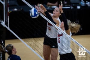 Nebraska Cornhuskers outside hitter Merritt Beason (13) blocks a spike from Penn State Nittany Lions middle blocker Maggie Mendelson (44) during the semi-final round in the NCAA championship Thursday, December 19, 2024, in Louisville, Kentucky. Photo by John S. Peterson.
