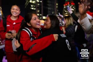 Nebraska Cornhuskers libero/defensive specialist Lexi Rodriguez (8) hugs her mom at the arrival before taking on Penn State Nittany Lions during the semi-final round in the NCAA championship Thursday, December 19, 2024, in Louisville, Kentucky. Photo by John S. Peterson.