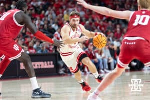 Nebraska Cornhuskers guard Sam Hoiberg (1) drives the lane against Indiana Hoosiers center Oumar Ballo (11) and Luke Goode in the first half during a college basketball game Friday, December 13, 2024 in Lincoln, Nebraska. Photo by Jaelle Johnson.