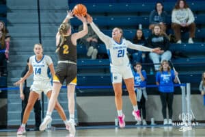 Creighton Bluejays Molly Mogensen blocks a shot during a college basketball game against the Wyoming Cowgirls on December 17th, 2024 in Omaha Nebraska. Photo by Brandon Tiedemann.