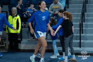 Creighton Bluejays Brook Littrell (33) gives five to the fans running out on the court during a college basketball game against the Wyoming Cowgirls on December 17th, 2024, in Omaha, Nebraska. Photo by Brandon Tiedemann.