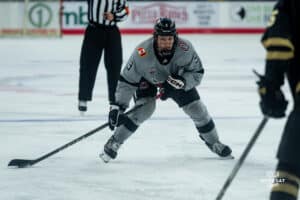 Forward, Brady Risk, looking for an outlet pass during a hockey match at Baxter Arena on Saturday, December 14, 2024, in Omaha, Nebraska. Photo by Collin Stilen.