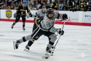 Forward, Chase LaPinta, takes a shot during a hockey match at Baxter Arena on Saturday, December 14, 2024, in Omaha, Nebraska. Photo by Collin Stilen.