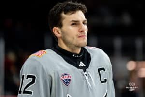 Defenseman, Nolan Krenzen, looks at his opponents during a hockey match at Baxter Arena on Saturday, December 14, 2024, in Omaha, Nebraska. Photo by Collin Stilen.