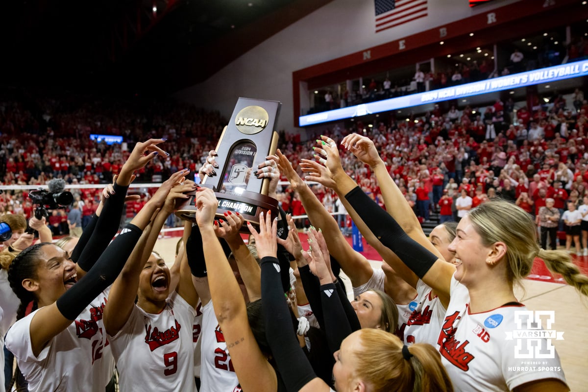 NCAA Regional Nebraska v Wisconsin | December 15, 2024. Nebraska Cornhuskers celebrate with the trophy after the win over the Wisconsin Badgers during the final regional match in the NCAA championship Sunday, December 15, 2024, in Lincoln, Nebraska. Photo by John S. Peterson.