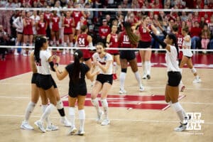 Nebraska Cornhuskers celebrate a point going into match point against the Wisconsin Badgers during the final regional match in the NCAA championship Sunday, December 15, 2024, in Lincoln, Nebraska. Photo by John S. Peterson.