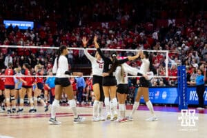 Nebraska Cornhuskers celebrates the win in the fourth set against the Dayton Flyers during the first regional match in the NCAA championship Friday, December 13, 2024, in Lincoln, Nebraska. Photo by John S. Peterson.