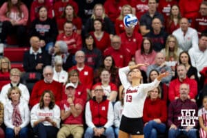 Nebraska Cornhuskers outside hitter Merritt Beason (13) serves the ball against the Dayton Flyers during the first regional match in the NCAA championship Friday, December 13, 2024, in Lincoln, Nebraska. Photo by John S. Peterson.