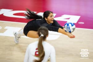 Nebraska Cornhuskers libero Lexi Rodriguez (8) digs the ball against the Dayton Flyers in the first set during the first regional match in the NCAA championship Friday, December 13, 2024, in Lincoln, Nebraska. Photo by John S. Peterson.