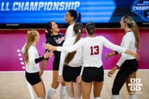 Nebraska Cornhuskers libero Lexi Rodriguez (8) congradulates outside hitter Harper Murray (27) on a kill against the Dayton Flyers during the first regional match in the NCAA championship Friday, December 13, 2024, in Lincoln, Nebraska. Photo by John S. Peterson.