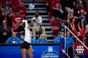 Nebraska Cornhuskers outside hitter Harper Murray (27) spikes the ball against the Dayton Flyers in the first set during the first regional match in the NCAA championship Friday, December 13, 2024, in Lincoln, Nebraska. Photo by John S. Peterson.