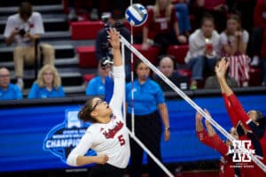 Nebraska Cornhuskers middle blocker Rebekah Allick (5) spikes the ball against the against the Dayton Flyers in the first set during the first regional match in the NCAA championship Friday, December 13, 2024, in Lincoln, Nebraska. Photo by John S. Peterson.