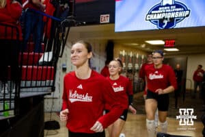 Nebraska Cornhuskers setter Bergen Reilly (2) running out to the court to warm-up against the Dayton Flyers during the first regional match in the NCAA championship Friday, December 13, 2024, in Lincoln, Nebraska. Photo by John S. Peterson.