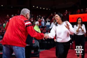 Nebraska Cornhuskers head coach Amy Williams shakes hands with a fan before taking on the Tarleton State Texans during a women’s college basketball game Wednesday, December 11, 2024, in Lincoln, Nebraska. Photo by John S. Peterson.