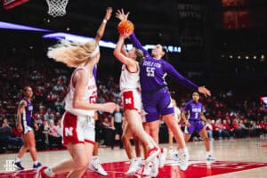 Nebraska Cornhuskers Allison Weidner (3) jumps to shoot a ball while Faith Acker (55) plays defense against the Tarleton State Texans during a college basketball game Wednesday, December 11, 2024, in Lincoln, Nebraska. Photo by Charlotte A. Gottfried.