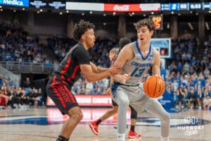 Creighton Bluejays Mason Miller drives to the lane during a college basketball game against the UNLV Rebels on December 7th, 2024 in Omaha Nebraska. Photo by Brandon Tiedemann.