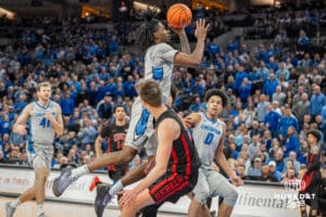 Creighton Bluejays Jamiya Neal drives to the hoop during a college basketball game against the UNLV Rebels on December 7th, 2024 in Omaha Nebraska. Photo by Brandon Tiedemann.