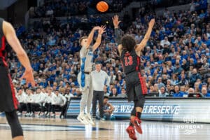 Creighton Bluejays Steven Ashworth attempts a three during a college basketball game against the UNLV Rebels on December 7th, 2024 in Omaha Nebraska. Photo by Brandon Tiedemann.